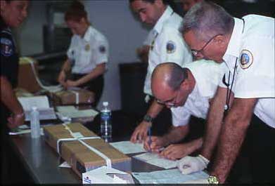 USDA packing turkey skins for shipment from the border to an approved taxidermy establishment.